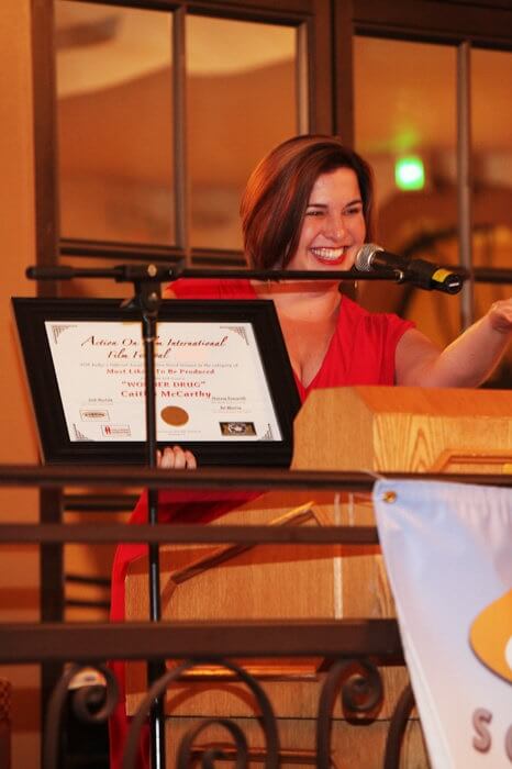 Caitlin McCarthy dedicating WONDER DRUG's "Most Likely To Be Produced" screenplay award to her mother in the audience at the Action on Film International Film Festival's Writers' Awards ceremony.