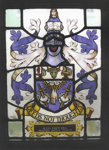 Photo of Sir Charles Dodds' stained glass window at the Worshipful Society of Apothecaries of London. Note the woman is holding an open book with the chemical structure for DES; this symbolizes how DES was unpatented and used in women’s medicine. This coat-of-arms is the first in history to include a chemical structure. Further down a knight's helmet signifies that Dodds was knighted for creating DES (among other achievements). The animals below the knight’s helmet represent how DES has been used in livestock and chickens. The hand hanging down shows Dodds' work in medicine and the pierced crabs (flanking the hand) represent Dodds' interest in fighting cancer. The motto "Deeds Not Thoughts" was developed by Dodds. Permission to post this picture on behalf of Caitlin McCarthy was granted by the Apothecaries Society: http://www.apothecaries.org.